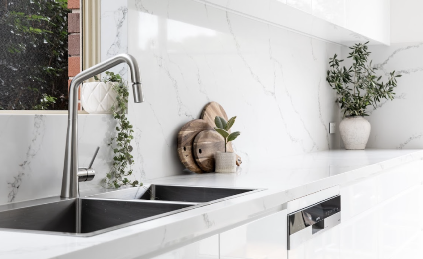 StoneCraft Kitchen & Bath | Projects At StoneCraft, we believe that every home should be a seamless reflection of its surroundings. The recent transformation of the Collins family kitchen, bathroom, and laundry room is a true testament to this philosophy. With a keen focus on harmonizing nature and modern design, we turned to our exclusive 2023 StoneCollection, featuring the exquisite Glacier Stone, to bring a touch of contemporary elegance to these spaces.