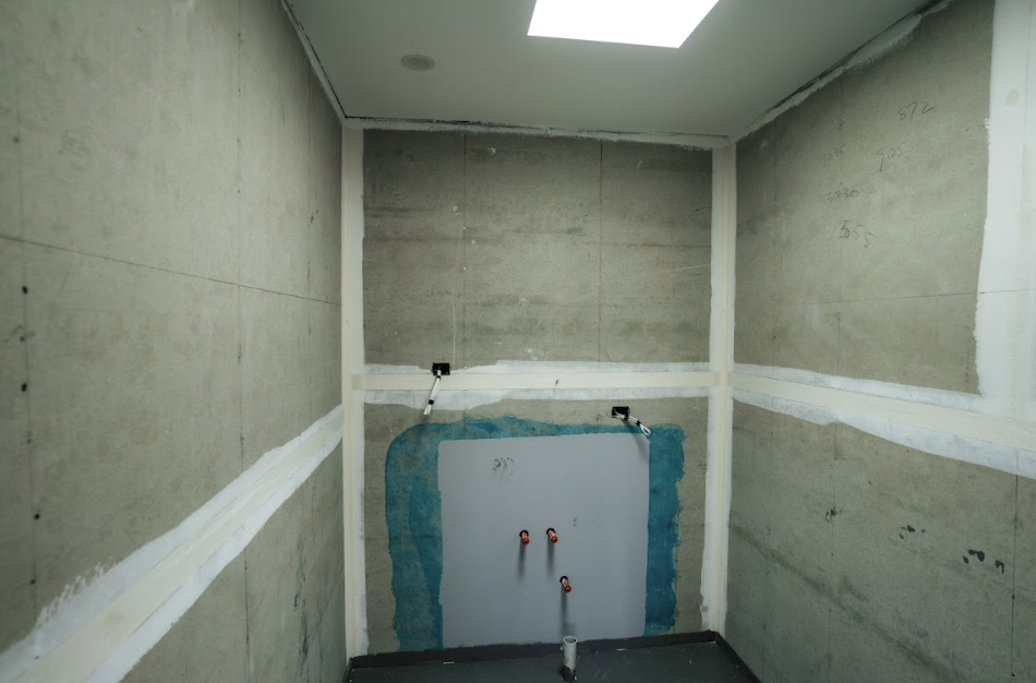 StoneCraft Kitchen & Bath | Lisa's Bathroom (Mount Cemento) We had the pleasure of transforming Lisa's modest half bath into a tranquil haven of relaxation and style. Drawing inspiration from soothing soft blue tones, we curated a calming ambiance that resonated with a sense of serenity. The carefully selected Mount Cemento stone played a pivotal role in shaping the space, enveloping the walls and the shower in an understated yet striking elegance.